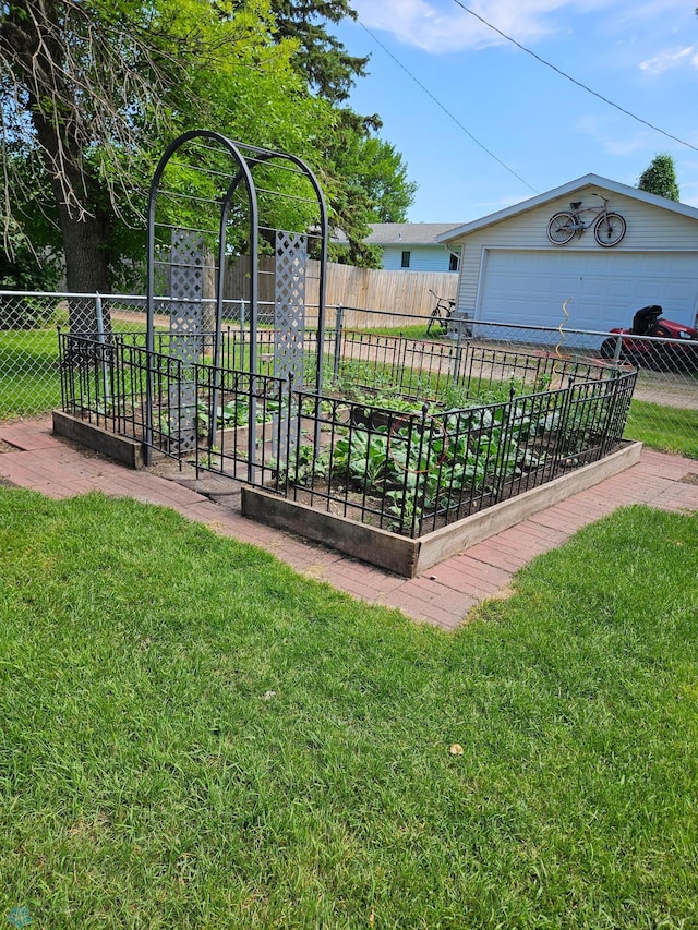 147 5th St, Felton, MN 56536 - view of yard featuring a garden and a garage