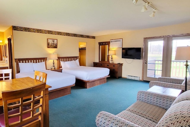 25150 Tame Fish Lake Rd Unit 552, Deerwood, MN 56444 - carpeted bedroom with baseboard heating, a wall mounted air conditioner, access to exterior, and rail lighting