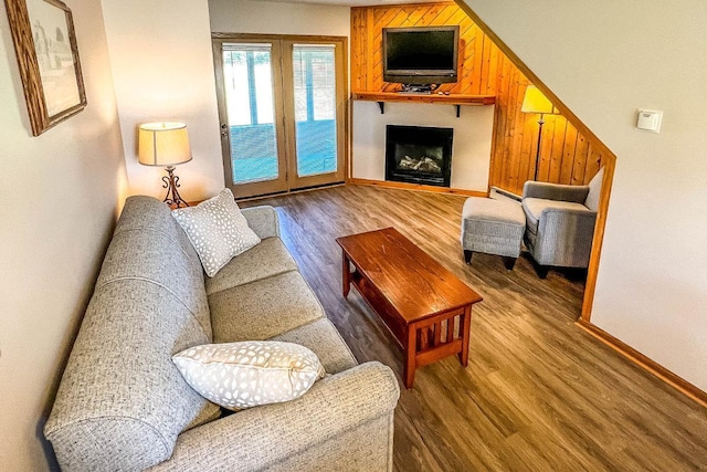 25150 Tame Fish Lake Rd Unit 552, Deerwood, MN 56444 - living area featuring wood finished floors, a large fireplace, and a baseboard heating unit