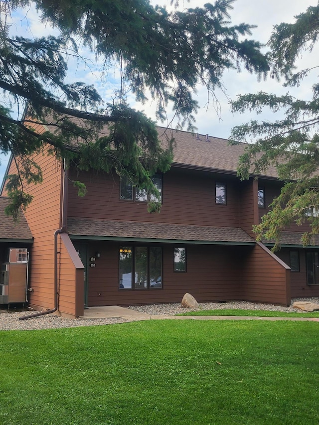 25150 Tame Fish Lake Rd Unit 552, Deerwood, MN 56444 - back of house with a lawn and a shingled roof