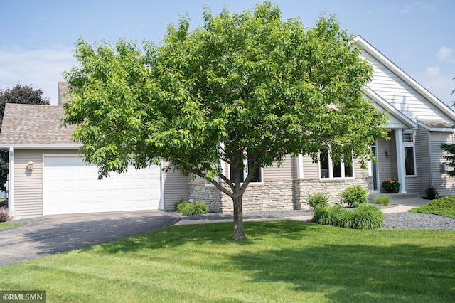 14578 Hunters Ln, Savage, MN 55378 - obstructed view of property with asphalt driveway, a front lawn, stone siding, and a garage