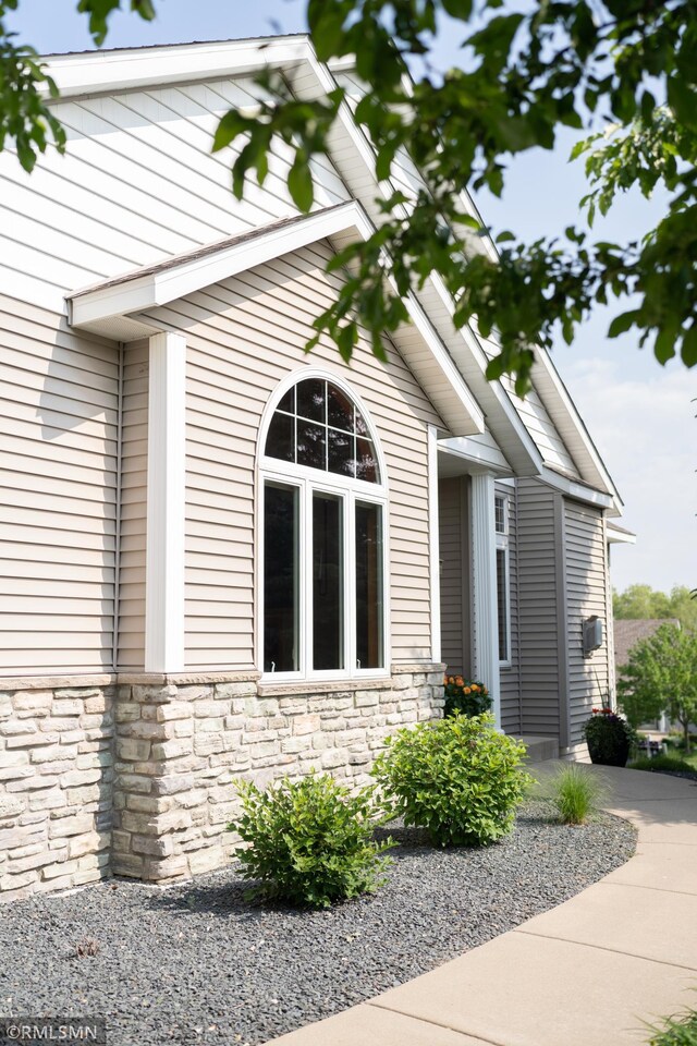 14578 Hunters Ln, Savage, MN 55378 - view of property exterior featuring stone siding