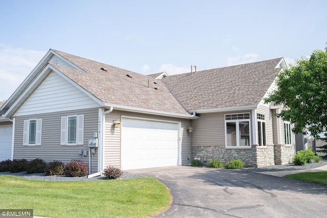 14578 Hunters Ln, Savage, MN 55378 - view of front of property with a garage, driveway, a shingled roof, and a front lawn