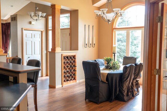 14578 Hunters Ln, Savage, MN 55378 - dining room with a chandelier, wood finished floors, and healthy amount of natural light
