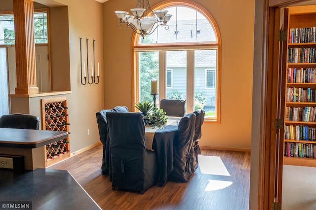 14578 Hunters Ln, Savage, MN 55378 - dining area featuring healthy amount of natural light, wood finished floors, and a chandelier