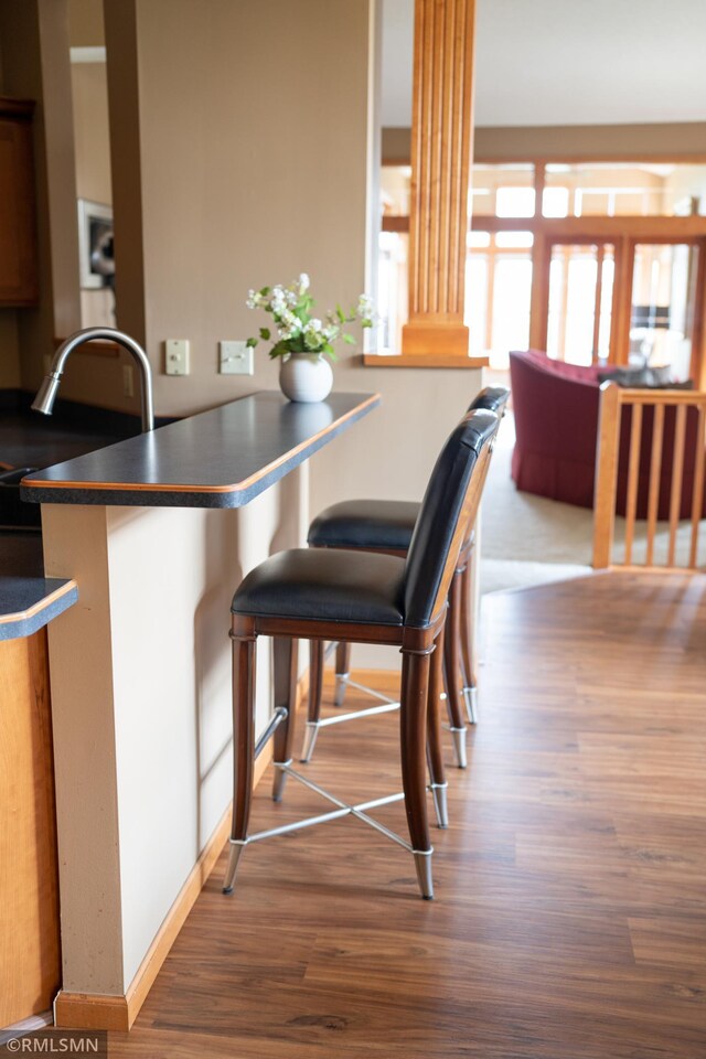 14578 Hunters Ln, Savage, MN 55378 - dining room with wood finished floors and decorative columns