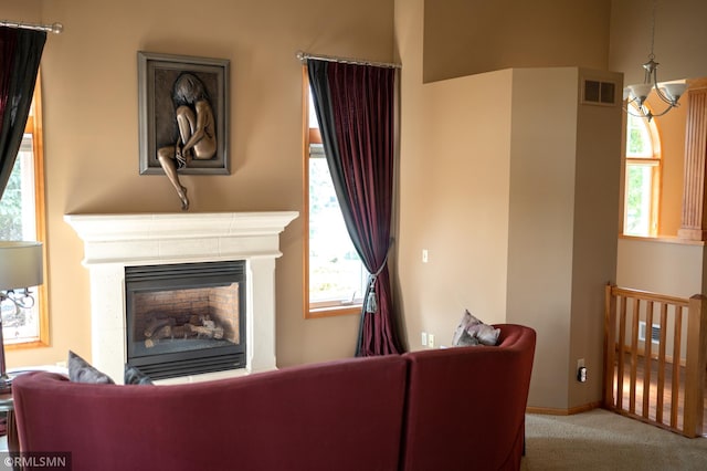 14578 Hunters Ln, Savage, MN 55378 - carpeted living area with healthy amount of natural light and a glass covered fireplace