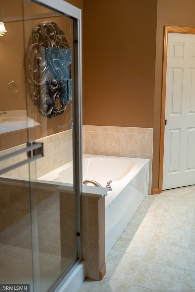 14578 Hunters Ln, Savage, MN 55378 - full bath with a bath, a shower stall, and tile patterned flooring