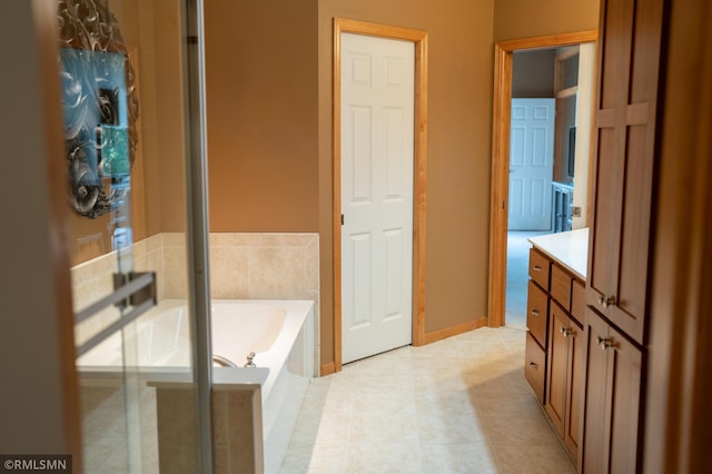 14578 Hunters Ln, Savage, MN 55378 - full bathroom with vanity, a garden tub, tile patterned flooring, and a shower with shower door