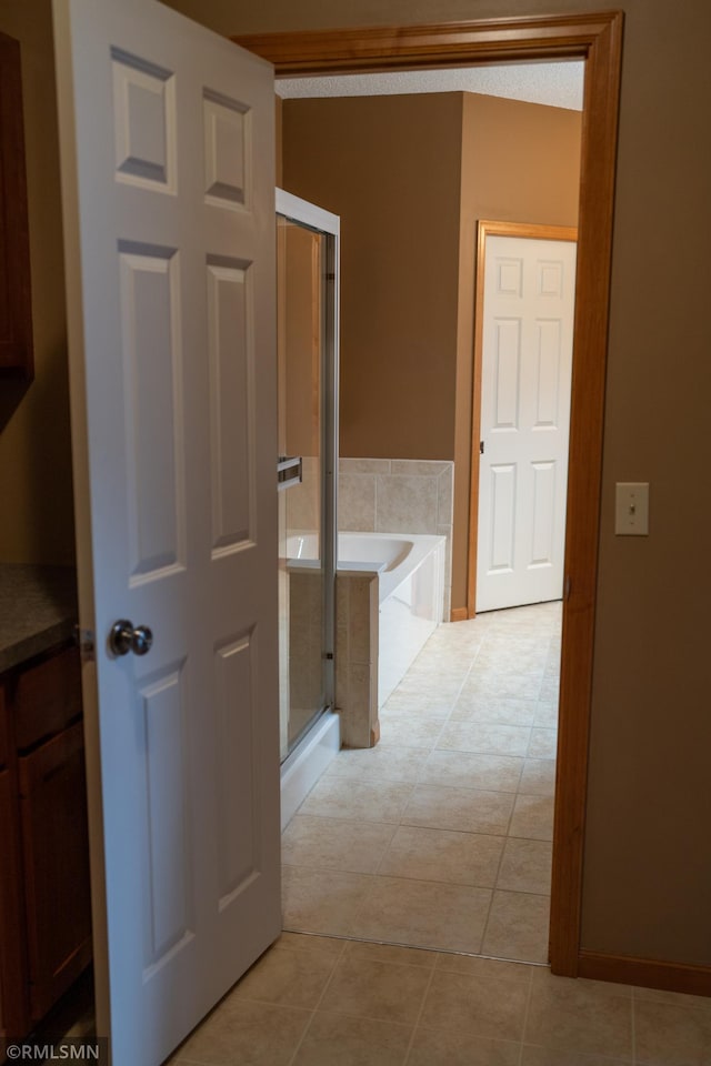 14578 Hunters Ln, Savage, MN 55378 - corridor featuring light tile patterned flooring