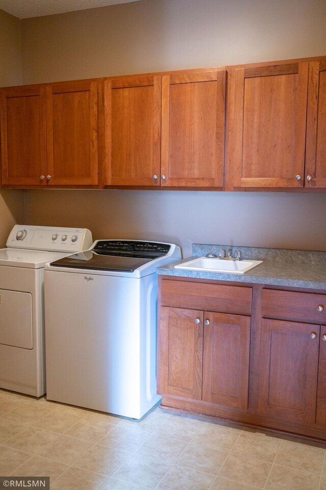 14578 Hunters Ln, Savage, MN 55378 - laundry area featuring cabinet space and washing machine and dryer