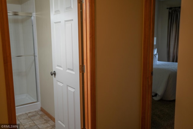 14578 Hunters Ln, Savage, MN 55378 - bathroom featuring a shower stall and baseboards