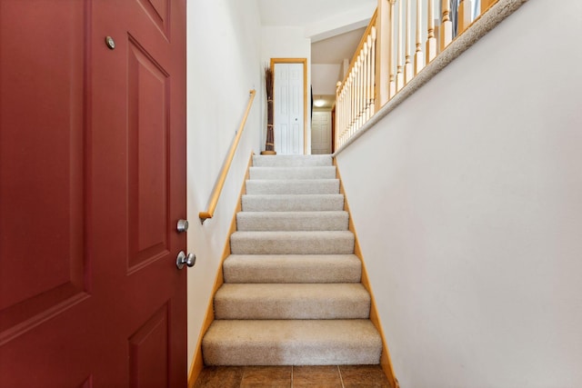 844 Coon Rapids Boulevard Extension NW, Coon Rapids, MN 55433 - staircase featuring baseboards and tile patterned floors