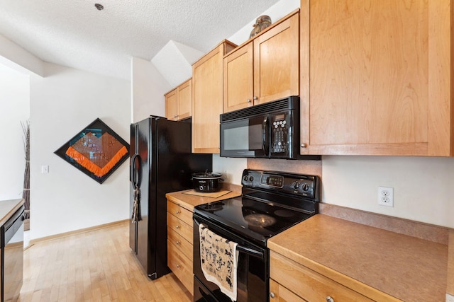 844 Coon Rapids Boulevard Extension NW, Coon Rapids, MN 55433 - kitchen featuring black appliances, light brown cabinets, light wood-type flooring, a textured ceiling, and light countertops