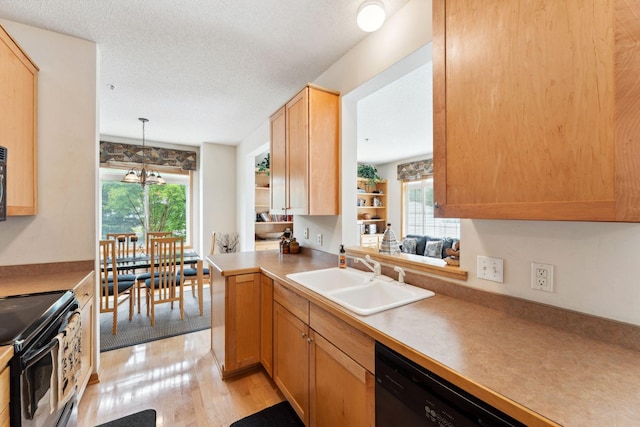 844 Coon Rapids Boulevard Extension NW, Coon Rapids, MN 55433 - kitchen featuring black electric range, light wood-style flooring, hanging light fixtures, a textured ceiling, and light countertops