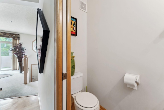 844 Coon Rapids Boulevard Extension NW, Coon Rapids, MN 55433 - half bath with toilet and wood finished floors
