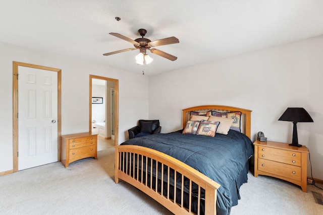 844 Coon Rapids Boulevard Extension NW, Coon Rapids, MN 55433 - bedroom featuring carpet floors, connected bathroom, and a ceiling fan