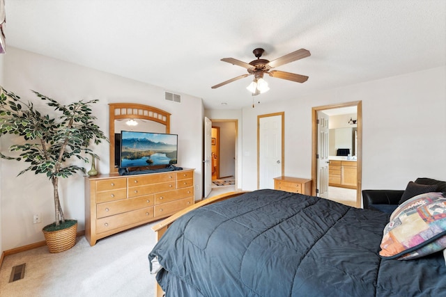 844 Coon Rapids Boulevard Extension NW, Coon Rapids, MN 55433 - bedroom with light colored carpet, ceiling fan, and ensuite bathroom