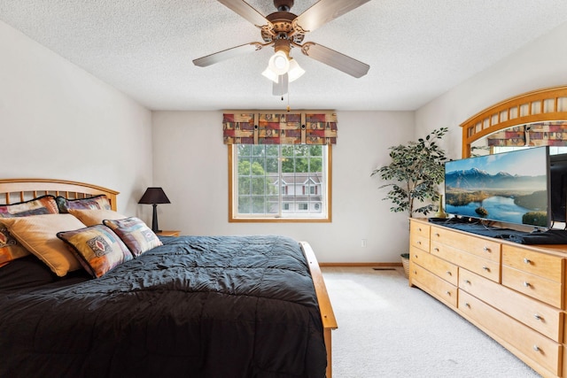 844 Coon Rapids Boulevard Extension NW, Coon Rapids, MN 55433 - bedroom with light carpet, a textured ceiling, and a ceiling fan