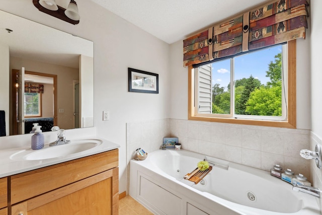 844 Coon Rapids Boulevard Extension NW, Coon Rapids, MN 55433 - bathroom featuring vanity, a whirlpool tub, and tile patterned flooring