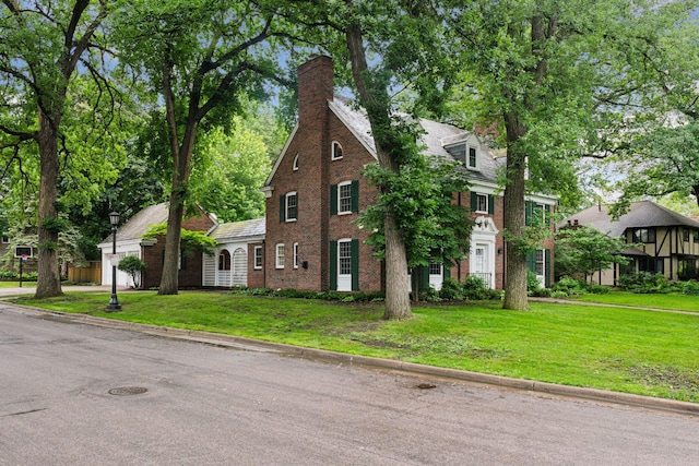 196 Mississippi River Blvd S, Saint Paul, MN 55105 - colonial home featuring a front yard, brick siding, and a chimney
