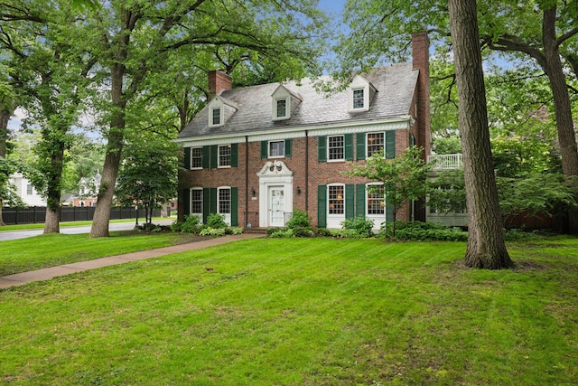 196 Mississippi River Blvd S, Saint Paul, MN 55105 - colonial inspired home featuring a chimney, brick siding, and a high end roof