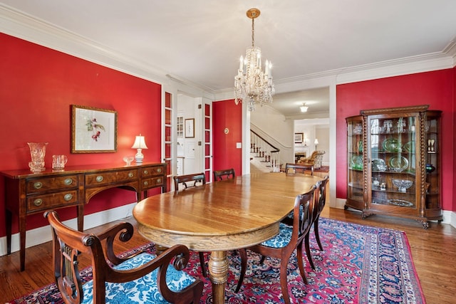 196 Mississippi River Blvd S, Saint Paul, MN 55105 - dining room featuring a chandelier, crown molding, stairs, and wood finished floors