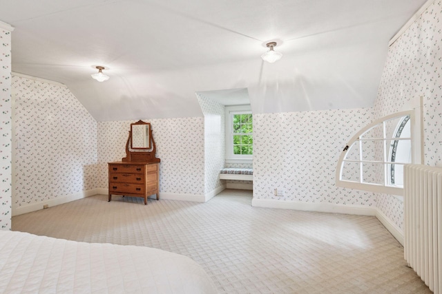 196 Mississippi River Blvd S, Saint Paul, MN 55105 - unfurnished bedroom with wallpapered walls, radiator heating unit, carpet flooring, and lofted ceiling