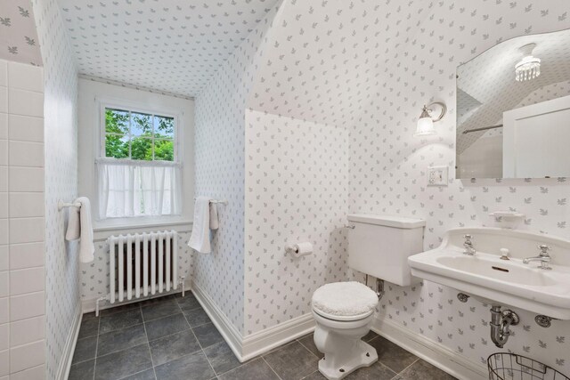 196 Mississippi River Blvd S, Saint Paul, MN 55105 - bathroom with radiator heating unit, wallpapered walls, vaulted ceiling, and tile patterned floors