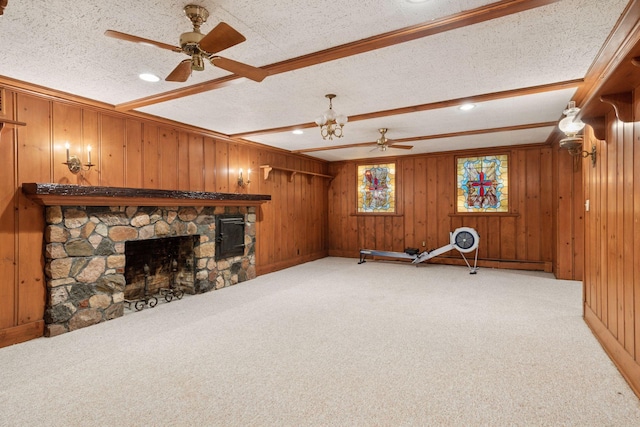 196 Mississippi River Blvd S, Saint Paul, MN 55105 - exercise room with a fireplace, light colored carpet, a ceiling fan, wooden walls, and crown molding
