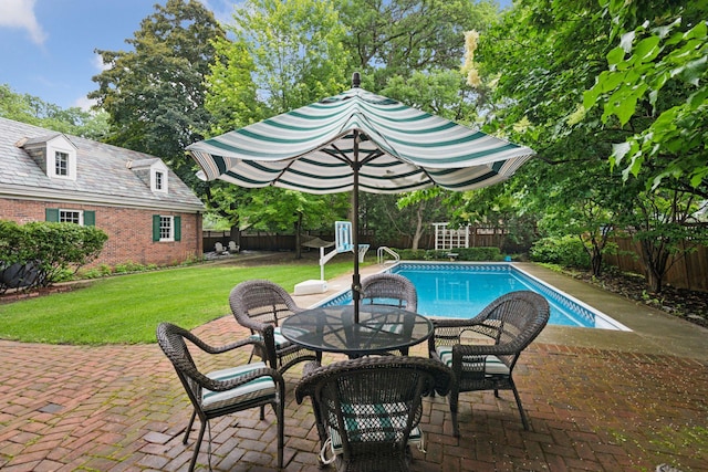 196 Mississippi River Blvd S, Saint Paul, MN 55105 - view of pool with a fenced backyard, a patio area, an outbuilding, and view of wooded area