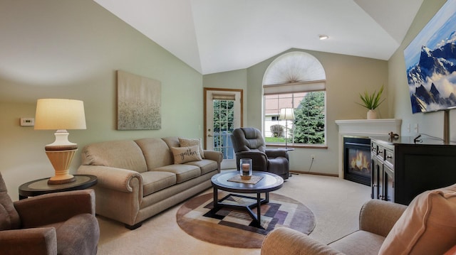 3504 Damon St Unit 38, Eau Claire, WI 54701 - living area with light colored carpet, vaulted ceiling, and a glass covered fireplace