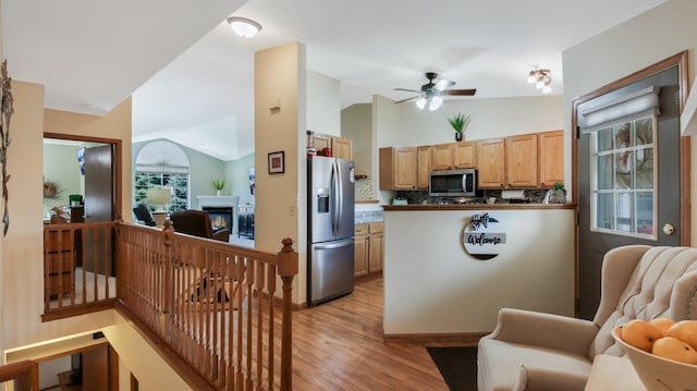 3504 Damon St Unit 38, Eau Claire, WI 54701 - kitchen featuring stainless steel appliances, lofted ceiling, light wood-type flooring, open floor plan, and a ceiling fan
