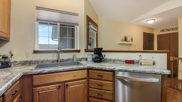 3504 Damon St Unit 38, Eau Claire, WI 54701 - kitchen featuring stainless steel dishwasher, brown cabinets, and light countertops