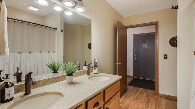 3504 Damon St Unit 38, Eau Claire, WI 54701 - full bathroom featuring wood finished floors and double vanity