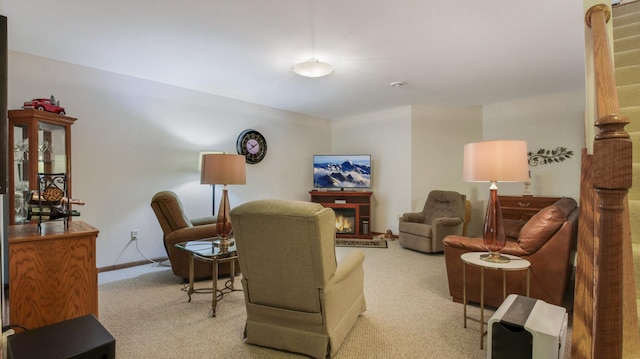 3504 Damon St Unit 38, Eau Claire, WI 54701 - living room with carpet floors and a warm lit fireplace