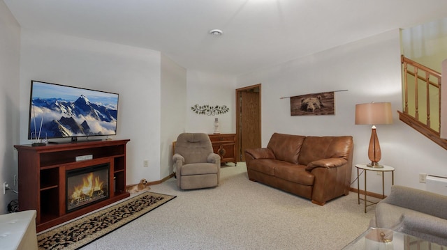 3504 Damon St Unit 38, Eau Claire, WI 54701 - carpeted living area featuring a glass covered fireplace and baseboards