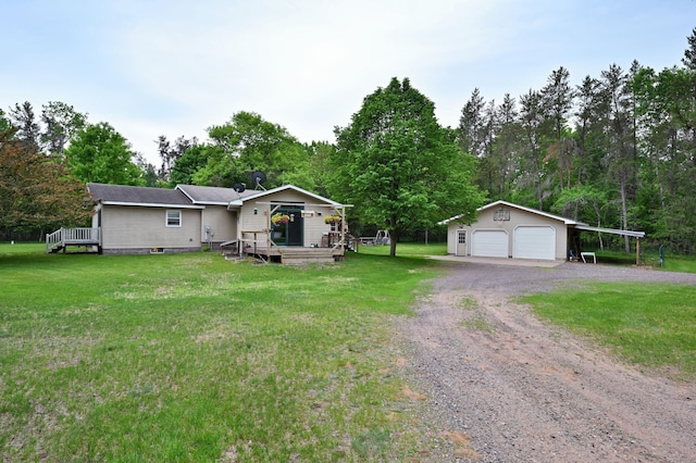 14102 Eau Claire Acres Cir, Gordon, WI 54838 - view of front of home with an outdoor structure, a garage, a front lawn, and a wooden deck