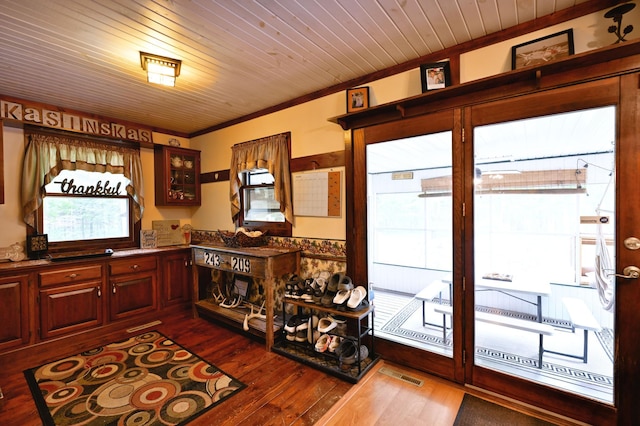 14102 Eau Claire Acres Cir, Gordon, WI 54838 - kitchen with dark wood finished floors, glass insert cabinets, crown molding, and wooden ceiling