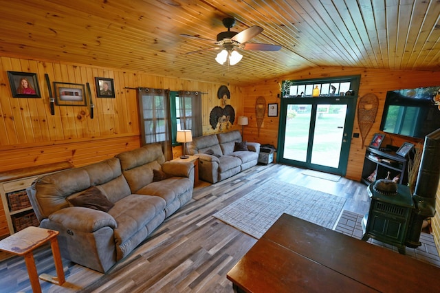14102 Eau Claire Acres Cir, Gordon, WI 54838 - living room with vaulted ceiling, wood walls, a ceiling fan, wood finished floors, and wood ceiling