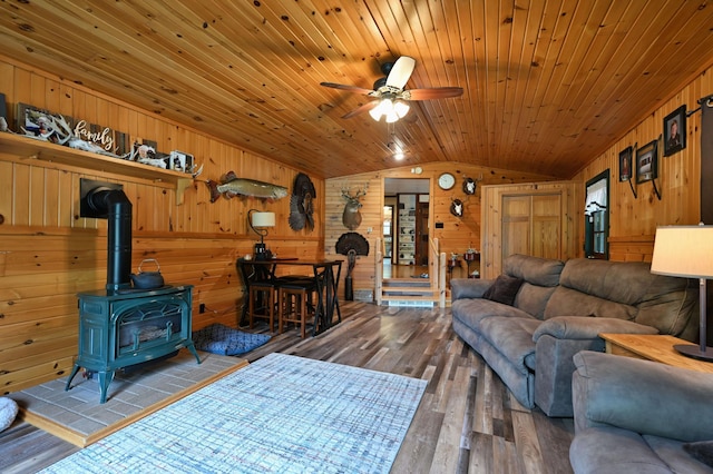 14102 Eau Claire Acres Cir, Gordon, WI 54838 - living room with lofted ceiling, hardwood / wood-style flooring, ceiling fan, wood ceiling, and wood walls