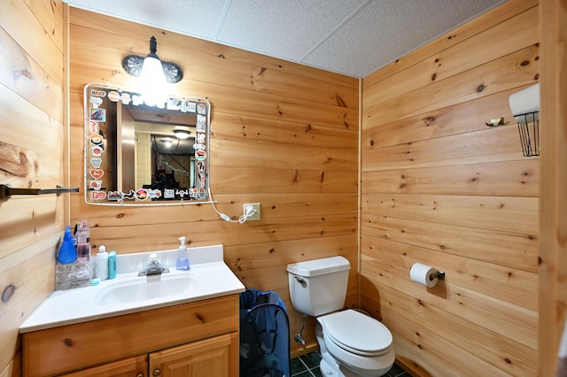 14102 Eau Claire Acres Cir, Gordon, WI 54838 - bathroom featuring wooden walls, vanity, and tile patterned flooring
