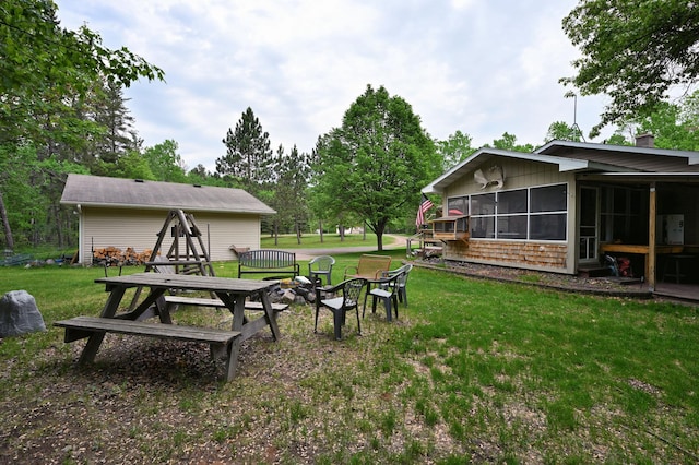 14102 Eau Claire Acres Cir, Gordon, WI 54838 - view of grassy yard with a sunroom