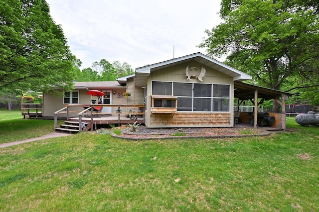 14102 Eau Claire Acres Cir, Gordon, WI 54838 - back of property with a wooden deck, a yard, and a sunroom
