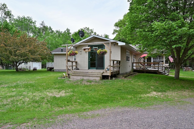 14102 Eau Claire Acres Cir, Gordon, WI 54838 - view of front of house featuring a deck and a front lawn