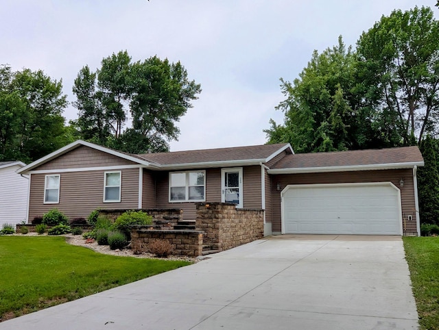200 Saratoga St, Marshall, MN 56258 - ranch-style home with an attached garage, a front yard, driveway, and a shingled roof