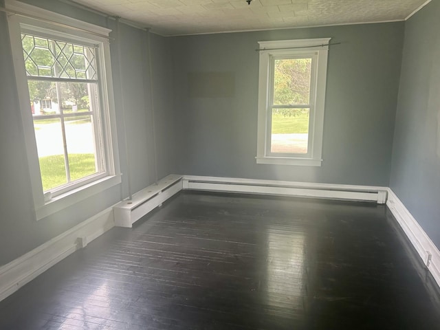 604 7th Ave E, Alexandria, MN 56308 - unfurnished room featuring dark wood-style flooring, healthy amount of natural light, and crown molding