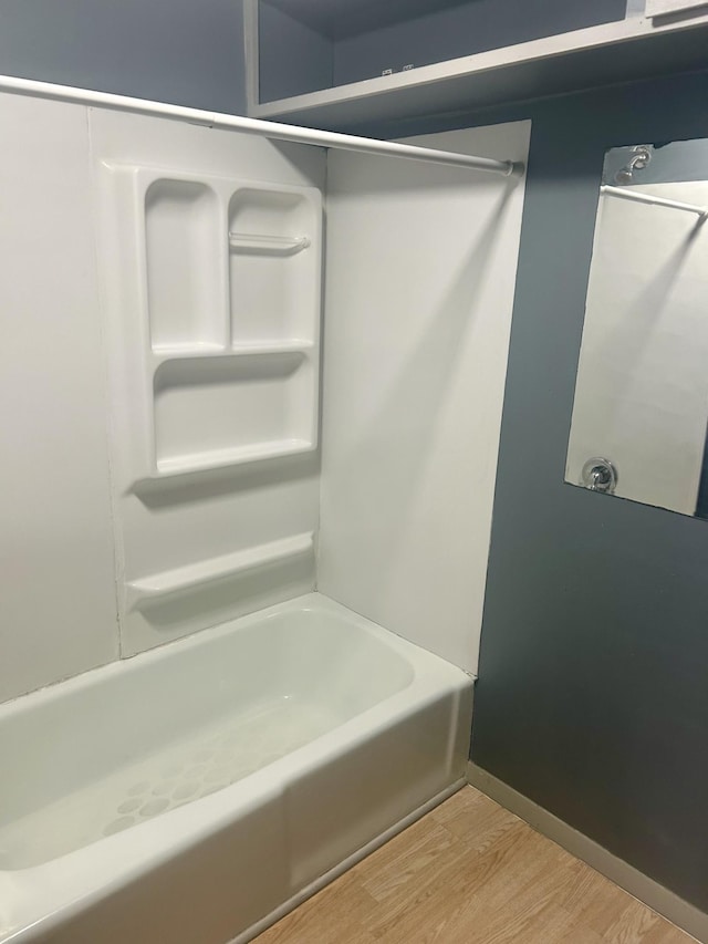 604 7th Ave E, Alexandria, MN 56308 - full bathroom featuring wood finished floors and tub / shower combination