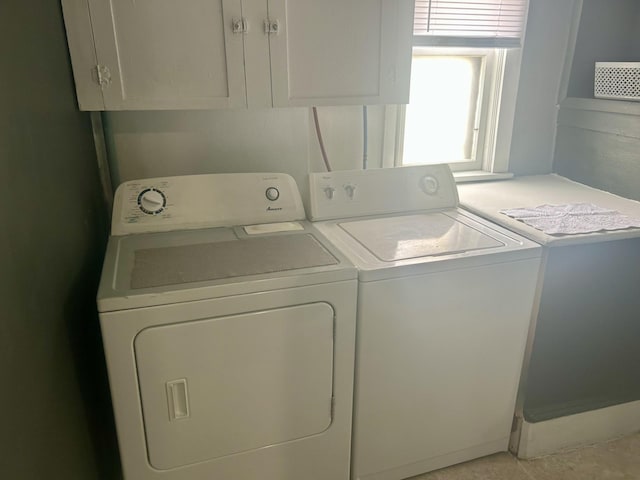 604 7th Ave E, Alexandria, MN 56308 - washroom featuring washing machine and dryer and cabinet space