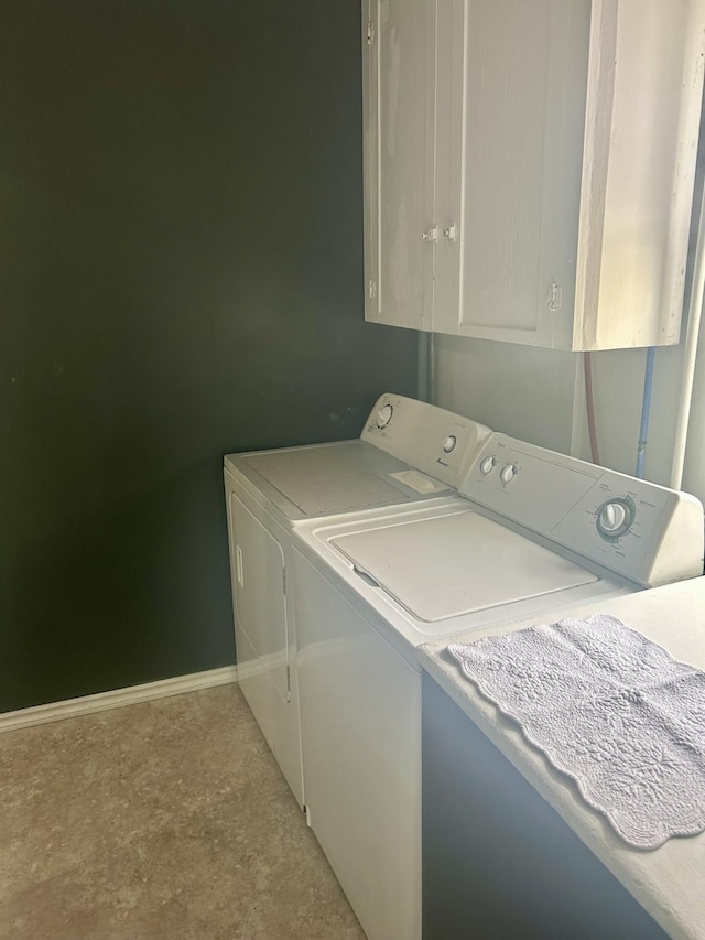 604 7th Ave E, Alexandria, MN 56308 - laundry area featuring washing machine and clothes dryer and cabinet space